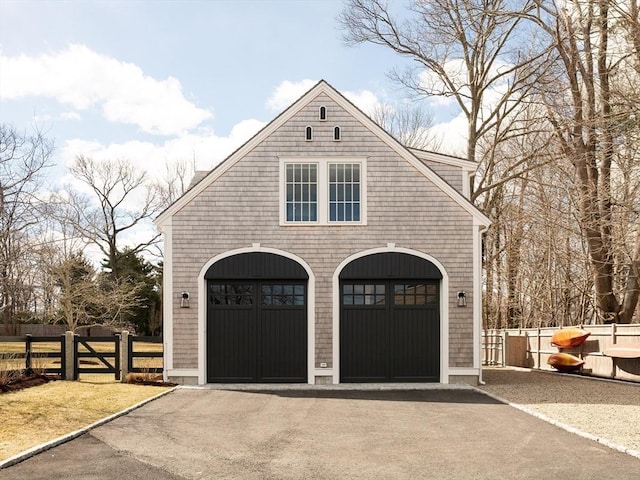 205 Powder Point Ave, Duxbury, MA 02332 - garage with fence and aphalt driveway