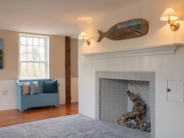 205 Powder Point Ave, Duxbury, MA 02332 - living room with a brick fireplace and wood finished floors