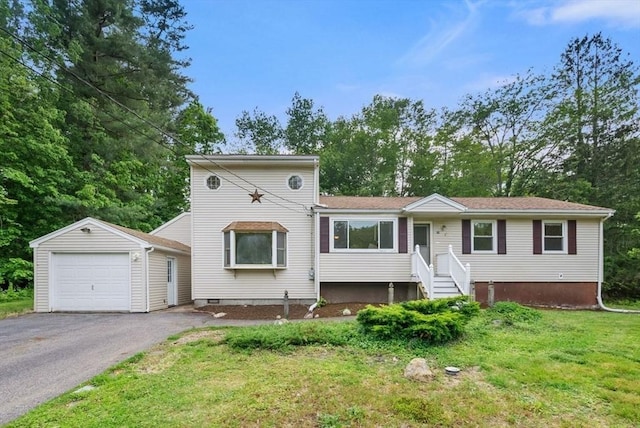 52 Richard Rd, Hanson, MA 02341 - view of front of house featuring an outdoor structure, asphalt driveway, a front yard, and view of scattered trees