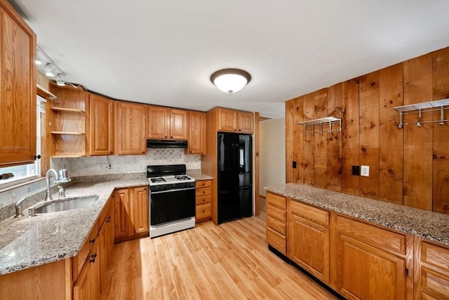52 Richard Rd, Hanson, MA 02341 - kitchen featuring white range with gas cooktop, freestanding refrigerator, under cabinet range hood, light wood-style floors, and light stone counters