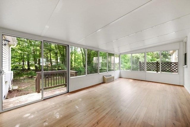 52 Richard Rd, Hanson, MA 02341 - unfurnished sunroom with a wall mounted AC, wood finished floors, and vaulted ceiling
