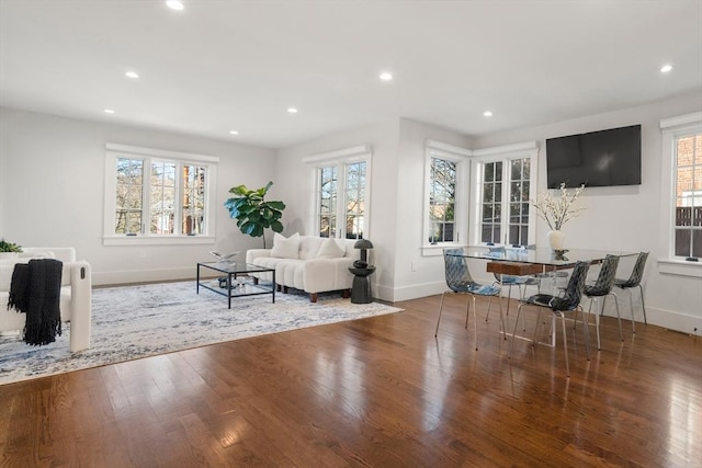 living area featuring recessed lighting, baseboards, and wood finished floors