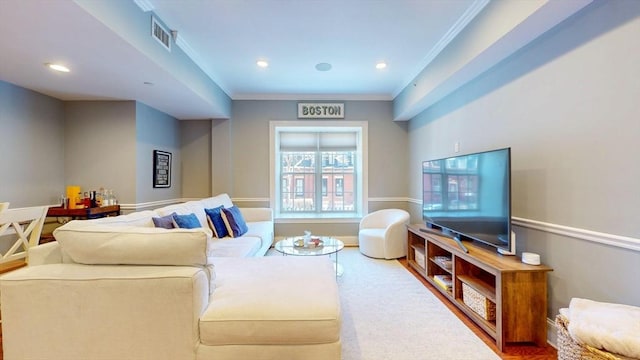 living area with crown molding, recessed lighting, and visible vents