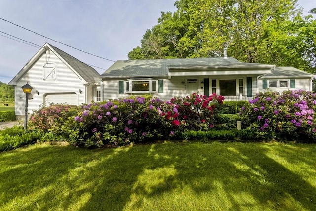 957 Homestead Ave, Holyoke, MA 01040 - view of front of home featuring covered porch, a front lawn, and a garage