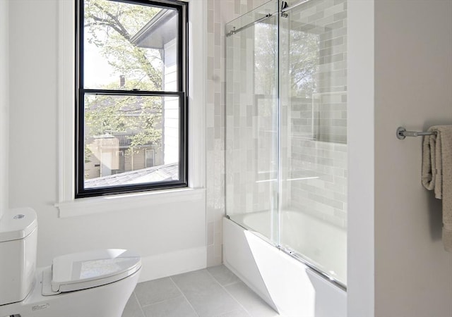 133 Fayerweather St Unit 1, Cambridge, MA 02138 - bathroom featuring tile patterned flooring and combined bath / shower with glass door