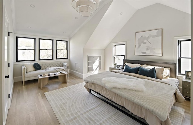 133 Fayerweather St Unit 1, Cambridge, MA 02138 - bedroom featuring multiple windows, lofted ceiling, light wood-style floors, and ornamental molding