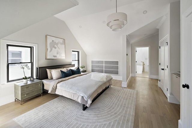 133 Fayerweather St Unit 1, Cambridge, MA 02138 - bedroom with lofted ceiling and light wood-style floors