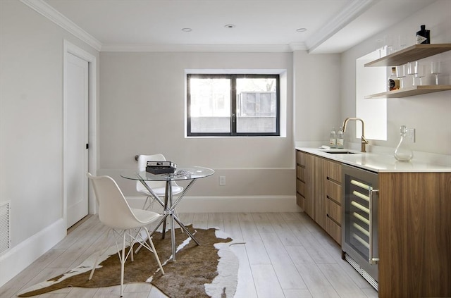 133 Fayerweather St Unit 1, Cambridge, MA 02138 - dining area with wine cooler, light wood finished floors, and crown molding