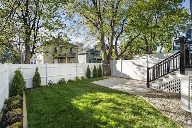 133 Fayerweather St Unit 1, Cambridge, MA 02138 - fenced backyard featuring a patio