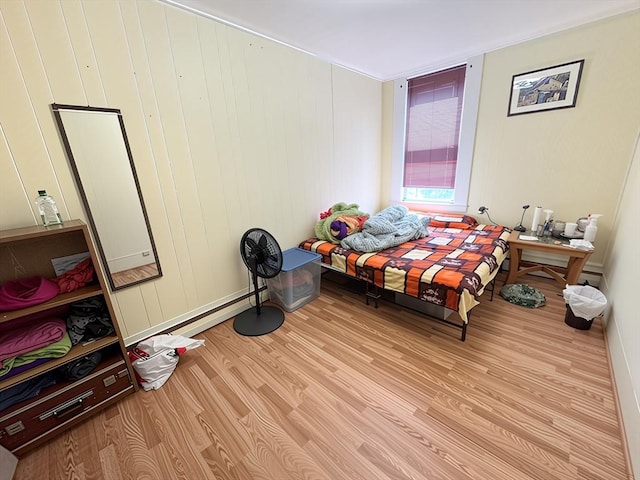 bedroom with light wood finished floors