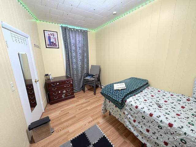 bedroom with wood finished floors