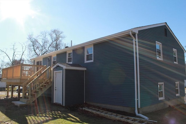 back of property featuring a deck