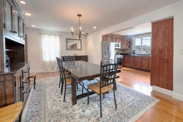 dining area featuring light wood finished floors and a wealth of natural light