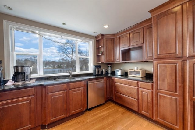 kitchen featuring brown cabinets, a sink, open shelves, light wood finished floors, and dishwasher