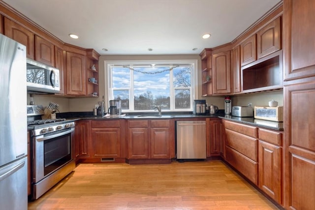 kitchen featuring open shelves, dark countertops, and appliances with stainless steel finishes