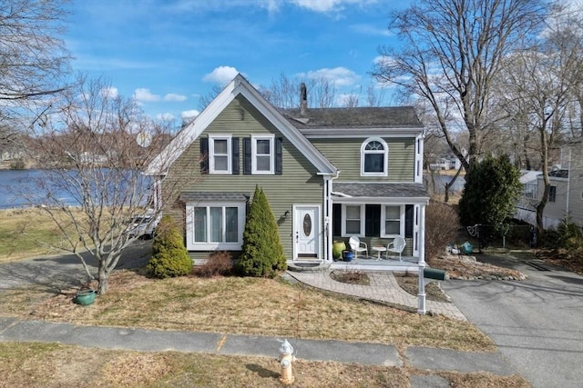 view of front of home with aphalt driveway and covered porch