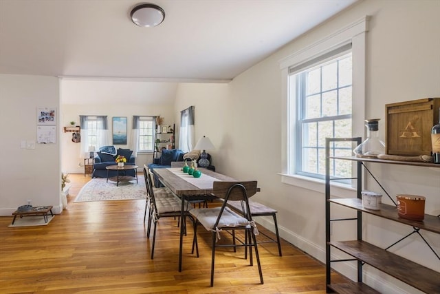 155 Great Marsh Rd, Barnstable, MA 02632 - dining area featuring plenty of natural light, wood finished floors, and baseboards