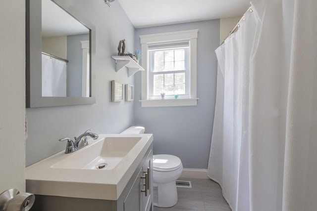 155 Great Marsh Rd, Barnstable, MA 02632 - bathroom with toilet, vanity, and tile patterned floors