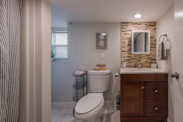 155 Great Marsh Rd, Barnstable, MA 02632 - bathroom featuring marble finish floors, toilet, vanity, and baseboards