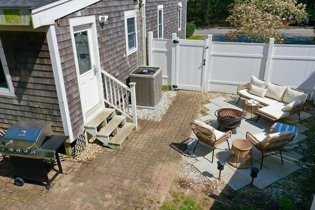 155 Great Marsh Rd, Barnstable, MA 02632 - view of patio / terrace with entry steps, cooling unit, area for grilling, an outdoor living space with a fire pit, and a gate
