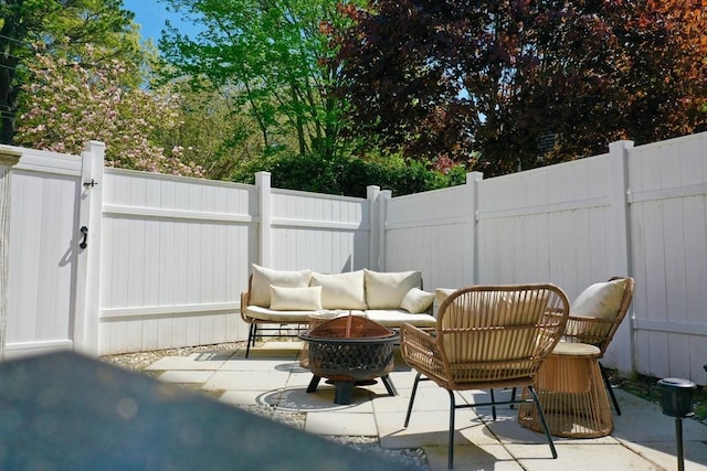 155 Great Marsh Rd, Barnstable, MA 02632 - fenced backyard with an outdoor fire pit and a patio
