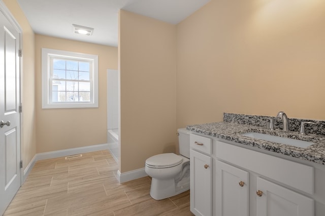 full bathroom featuring toilet, vanity, and separate shower and tub