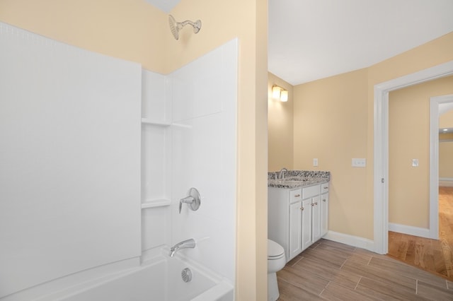 full bathroom featuring toilet, shower / washtub combination, and vanity