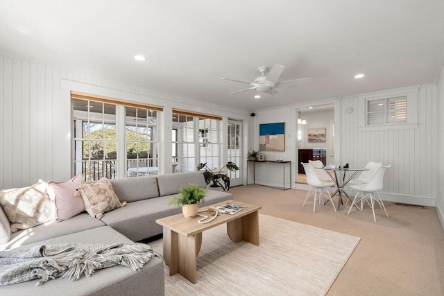 living room featuring recessed lighting, light colored carpet, and ceiling fan