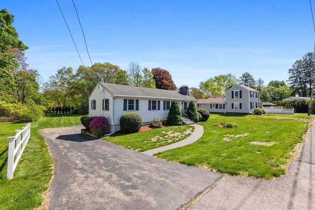 view of front of home featuring a chimney