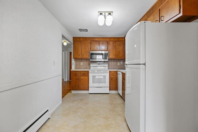 kitchen with white appliances, a baseboard radiator, brown cabinetry, backsplash, and light countertops