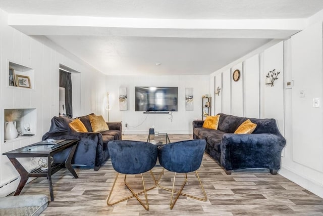 living room featuring wood finished floors and baseboards