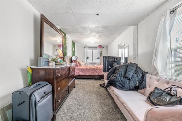 bedroom featuring light carpet