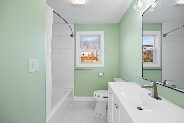 full bathroom with vanity, toilet, and tiled shower / bath combo