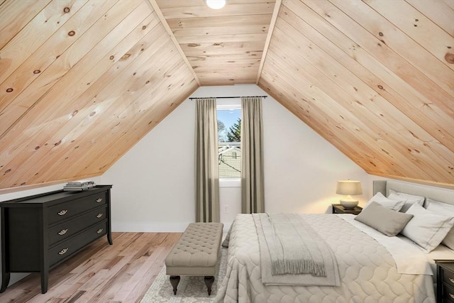 bedroom featuring light wood-type flooring, lofted ceiling, and wood ceiling