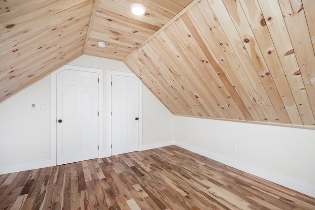 additional living space with wood-type flooring, wood ceiling, and vaulted ceiling