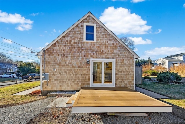 back of property featuring a wooden deck