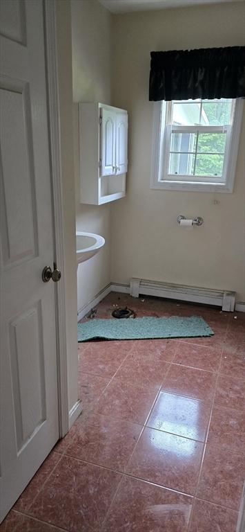 75 Downey Rd, North Brookfield, MA 01535 - bathroom with a baseboard heating unit and tile patterned floors