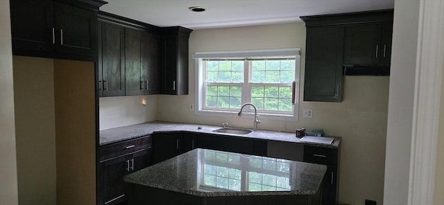75 Downey Rd, North Brookfield, MA 01535 - kitchen featuring a kitchen island, light stone countertops, and dark cabinetry