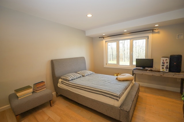 bedroom with light wood-type flooring