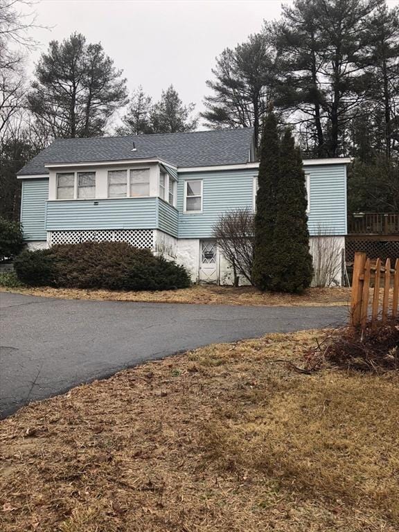 266 Pleasant St, Franklin, MA 02038 - view of front of home with roof with shingles and asphalt driveway