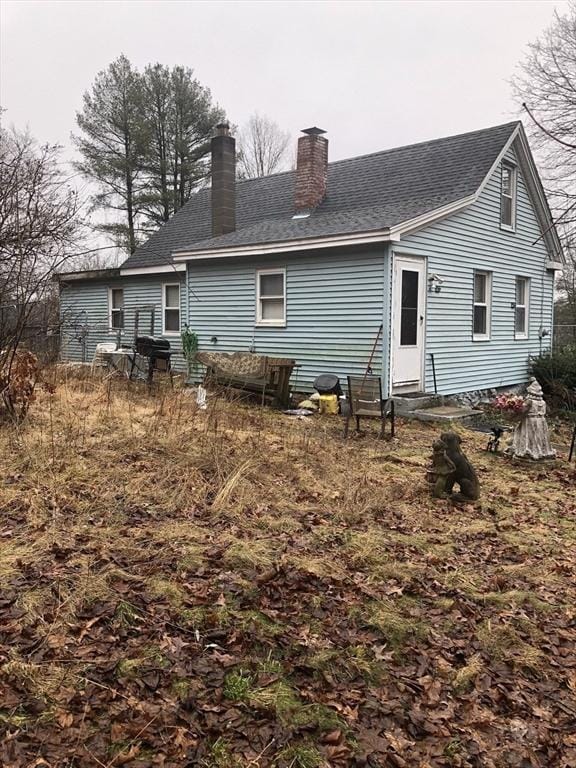 266 Pleasant St, Franklin, MA 02038 - rear view of property featuring a chimney, entry steps, and a shingled roof