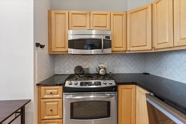 kitchen with appliances with stainless steel finishes, light brown cabinetry, and decorative backsplash