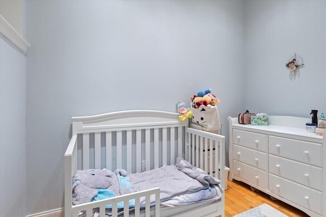 bedroom featuring light wood-style floors