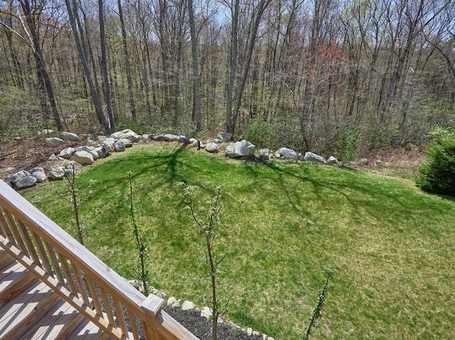 view of yard featuring a forest view