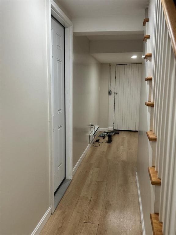 335 Euclid Ave, Lynn, MA 01904 - corridor featuring light wood finished floors, stairs, and baseboards