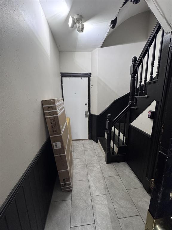 132 Chelsea St, Boston, MA 02128 - entryway featuring stairs and light tile patterned floors