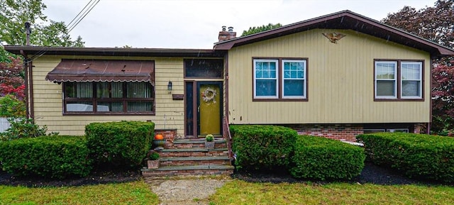 view of front of property with a chimney