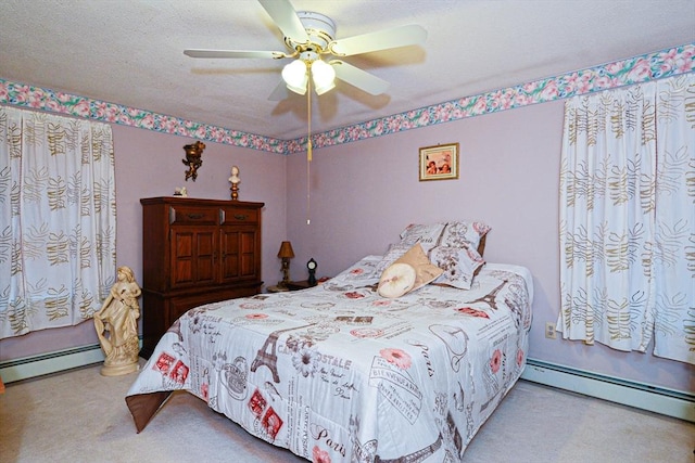 bedroom featuring baseboard heating, carpet flooring, and ceiling fan