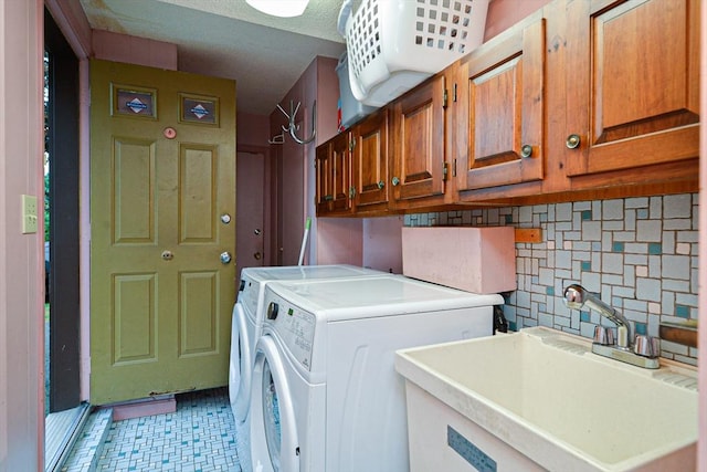 laundry area featuring cabinet space, washing machine and dryer, and light floors