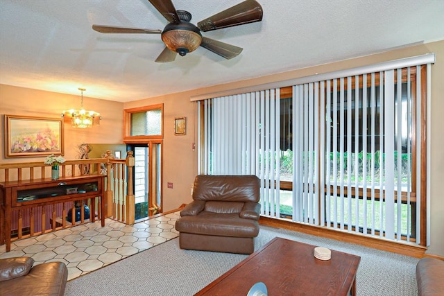 living room featuring a chandelier and a ceiling fan